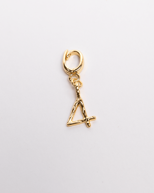 A gold-colored charm in the shape of a number four with a small clasp, displayed against a white background.