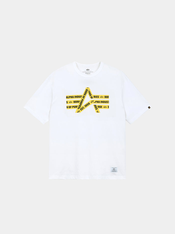 Alpha Caution Tape Tee by Alpha Industries is a white short-sleeve t-shirt with a yellow caution tape graphic and logo text on front.