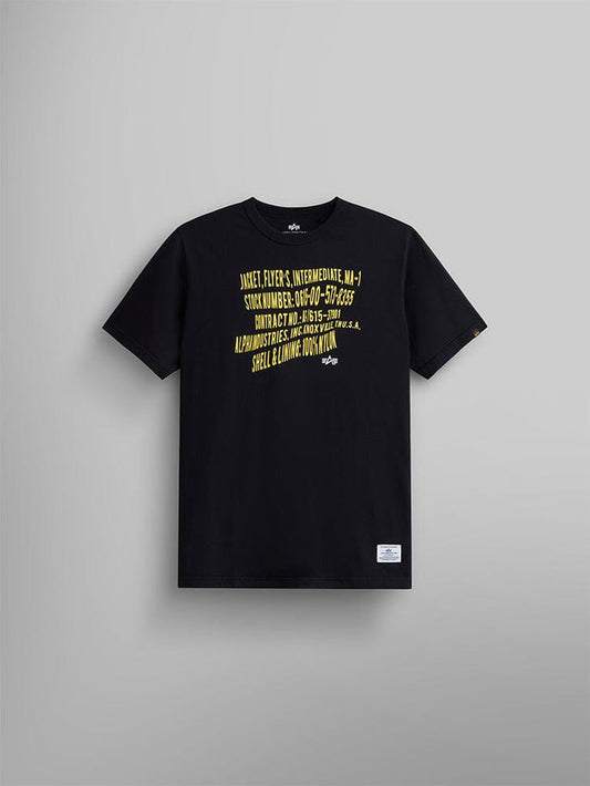 Alpha Warped Label Tee by Alpha Industries, black short-sleeve t-shirt with yellow diagonal text on front and white MA-1 warped label near bottom hem.