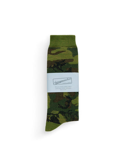 Anon X Alpha Camo Sock by Alpha Industries, green and brown camo, cotton-blend, light blue label around middle.