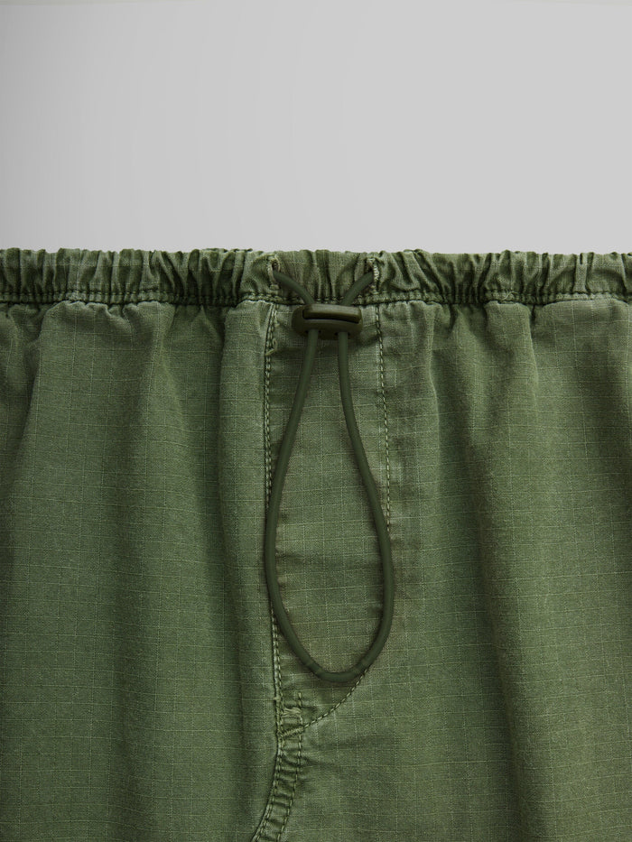 Close-up of the Women's Drawcord Skirt by Alpha Industries, with a convenient drawcord waistband and practical flap pockets.
