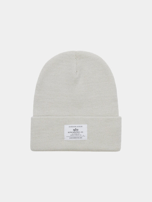 Essential Beanie by Alpha Industries in Dune White with fold-over cuff and rectangular white Alpha label with text and graphic.