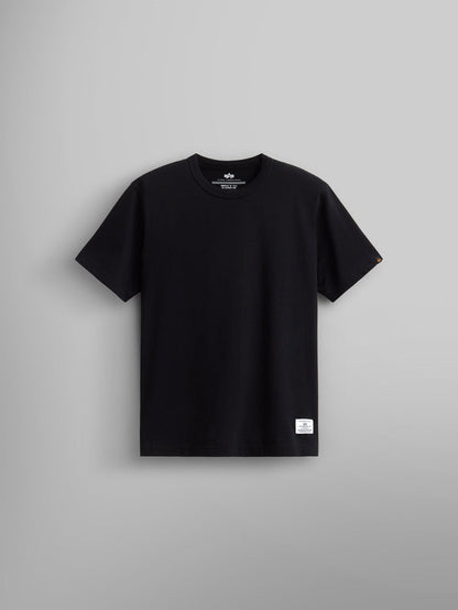 Alpha Industries Essential Tee in black cotton with short sleeves, crew neck, and small white label near the bottom hem.