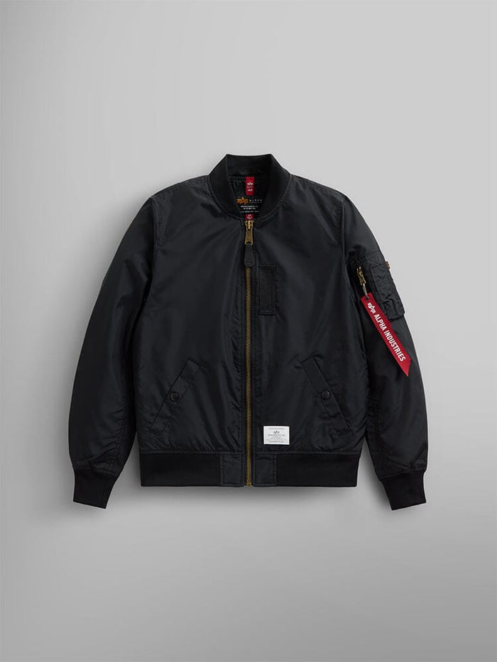The L-2B Skymaster Gen II Bomber Jacket W by Alpha Industries, Inc. is a lightweight black nylon bomber jacket featuring a front zipper, water-resistant fabric, side pockets, and an oxygen tab detail on the sleeve.