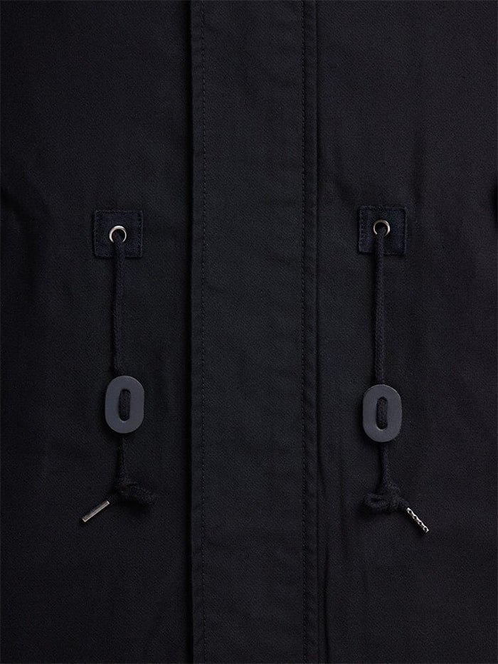 Alpha Industries M-59 Fishtail Mod Parka in black with two drawstrings with metal tips and black oval toggles threaded through metal eyelets.