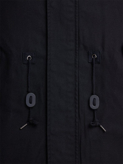 Alpha Industries M-59 Fishtail Mod Parka in black with two drawstrings with metal tips and black oval toggles threaded through metal eyelets.
