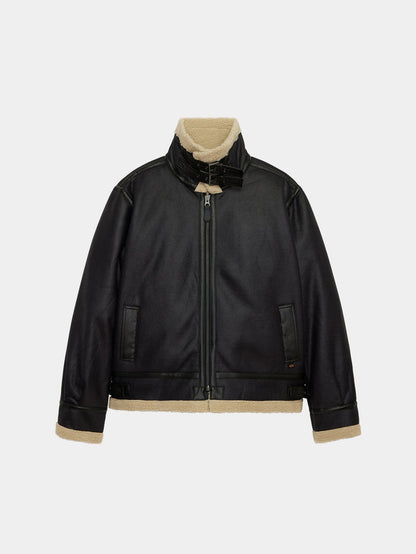 Mouton B-3 by Alpha Industries, black faux leather aviator jacket with shearling lining, front zipper, buckle collar, beige trim.