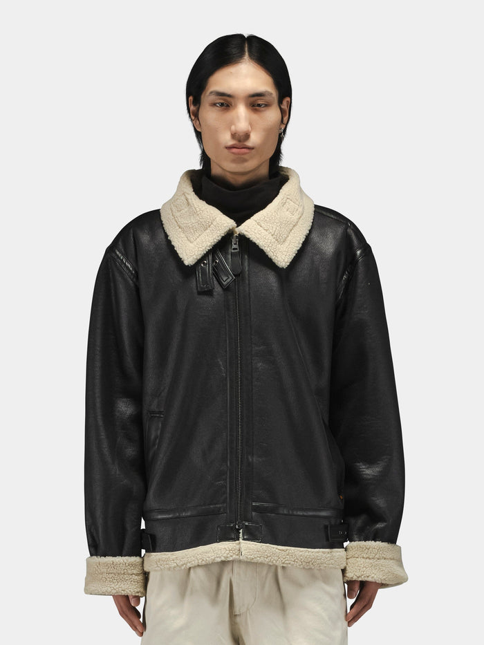 Alpha Industries Mouton B-3 black faux leather aviator jacket with beige shearling collar and cuffs.