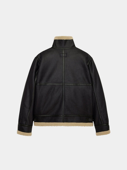 Alpha Industries Mouton B-3 jacket in black faux leather with beige shearling lining and trim.