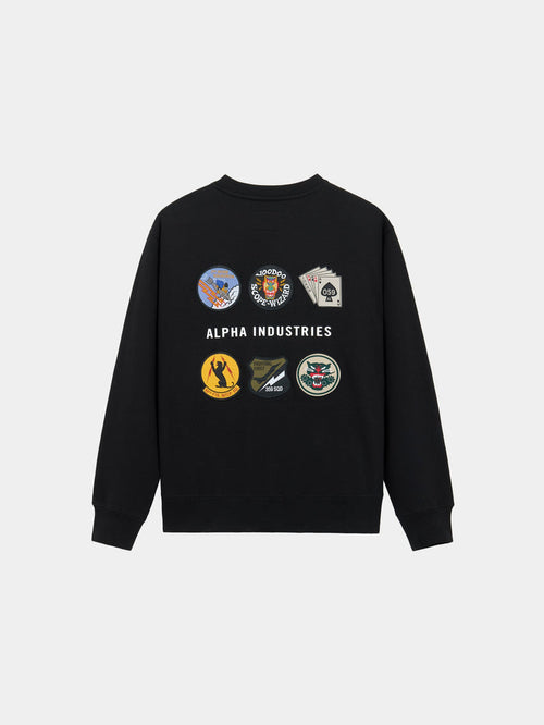 Patched Crewneck by Alpha Industries in Black, cotton-poly sweatshirt with graphic patches and Alpha Industries branding on back.