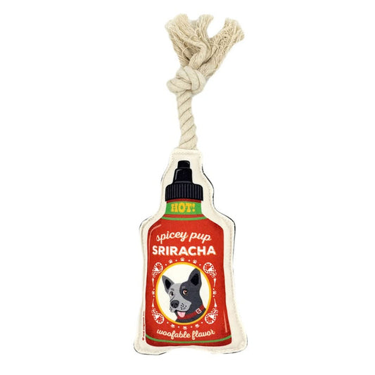 Dog toy designed like a Sriracha bottle with a rope handle on a white background