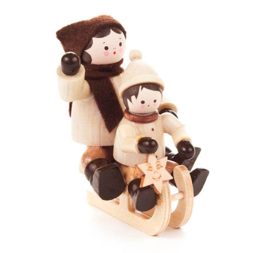 Sledding Children Figurine