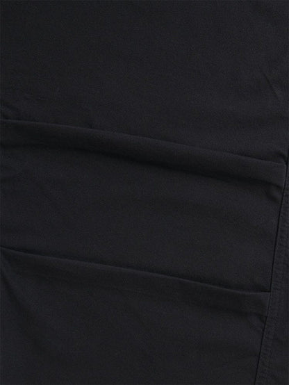 A close-up of the Women's Barrel Leg Pants in black by Alpha Industries highlights the fabric's seams and stitching, radiating the detailed craftsmanship reminiscent of high-waisted pants.