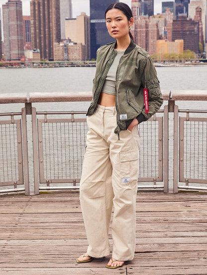 Alpha Industries Womens M-65 Cargo Pant Limestone, green bomber jacket, cropped top, sandals.