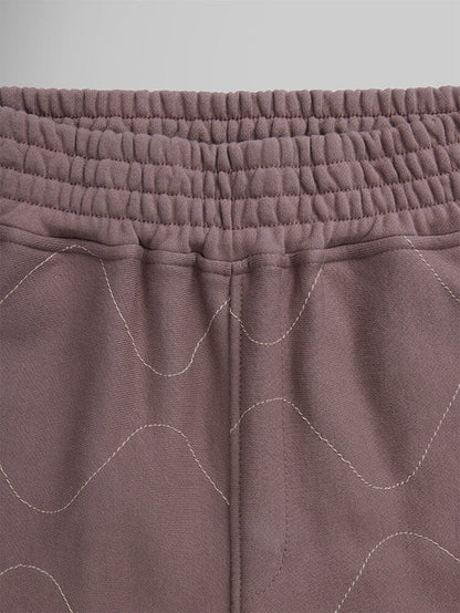 Alpha Industries Womens Quilted Shorts, mauve terry fleece, elastic waistband, decorative wavy stitching.
